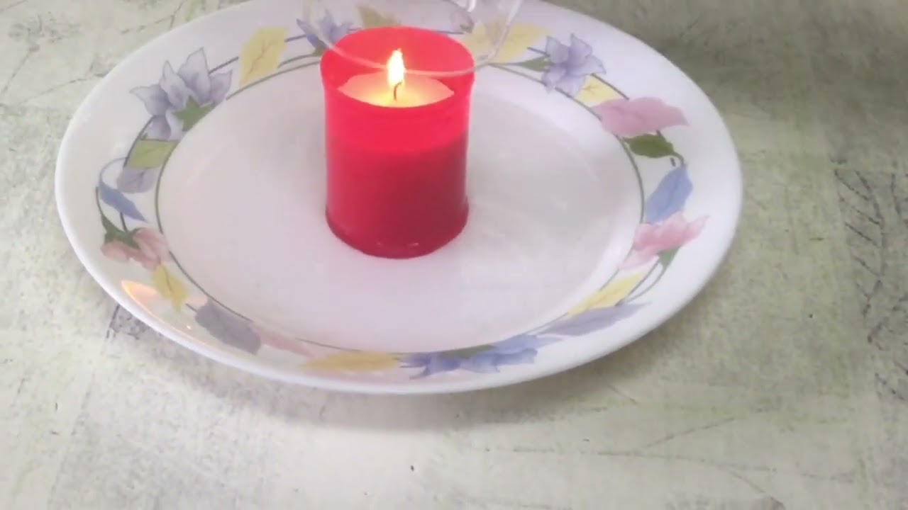 Vela con vaso